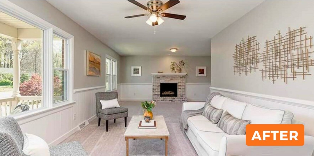 Finished living room with gray walls, white wainscoting and painted brick fireplace in Palm Bay, FL