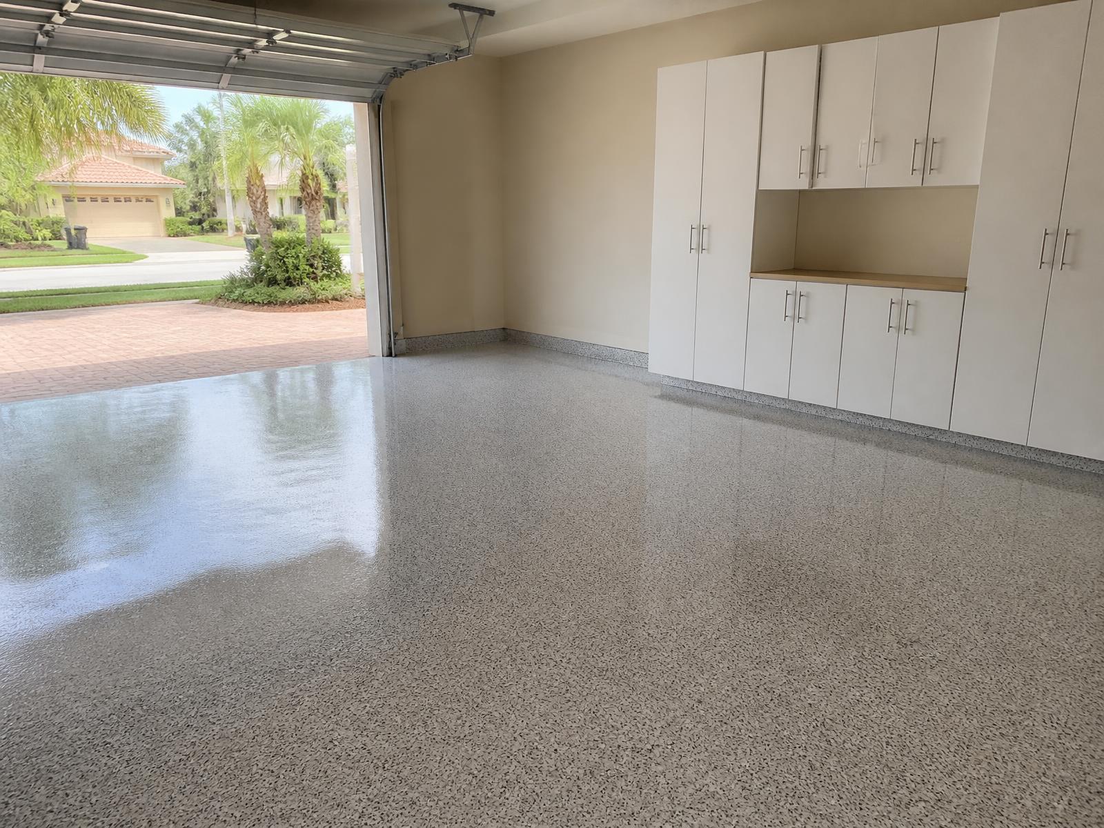 High-gloss white flake epoxy garage floor in Melbourne, FL
