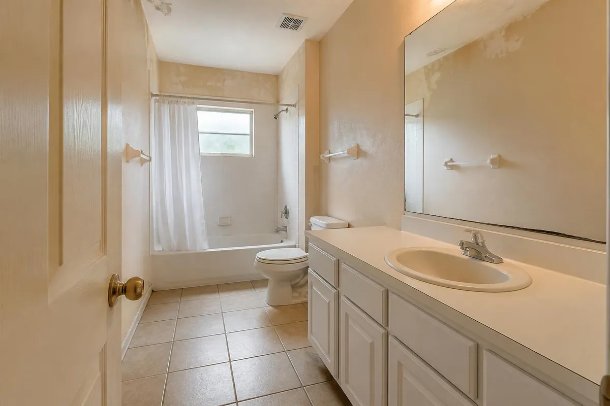 Bathroom with dated wall color before repainting in Cocoa Beach, FL