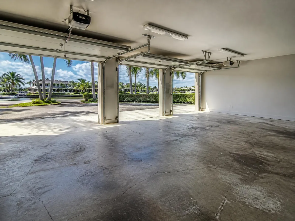 Cracked and oil-stained garage floor before epoxy coating in Palm Bay, FL