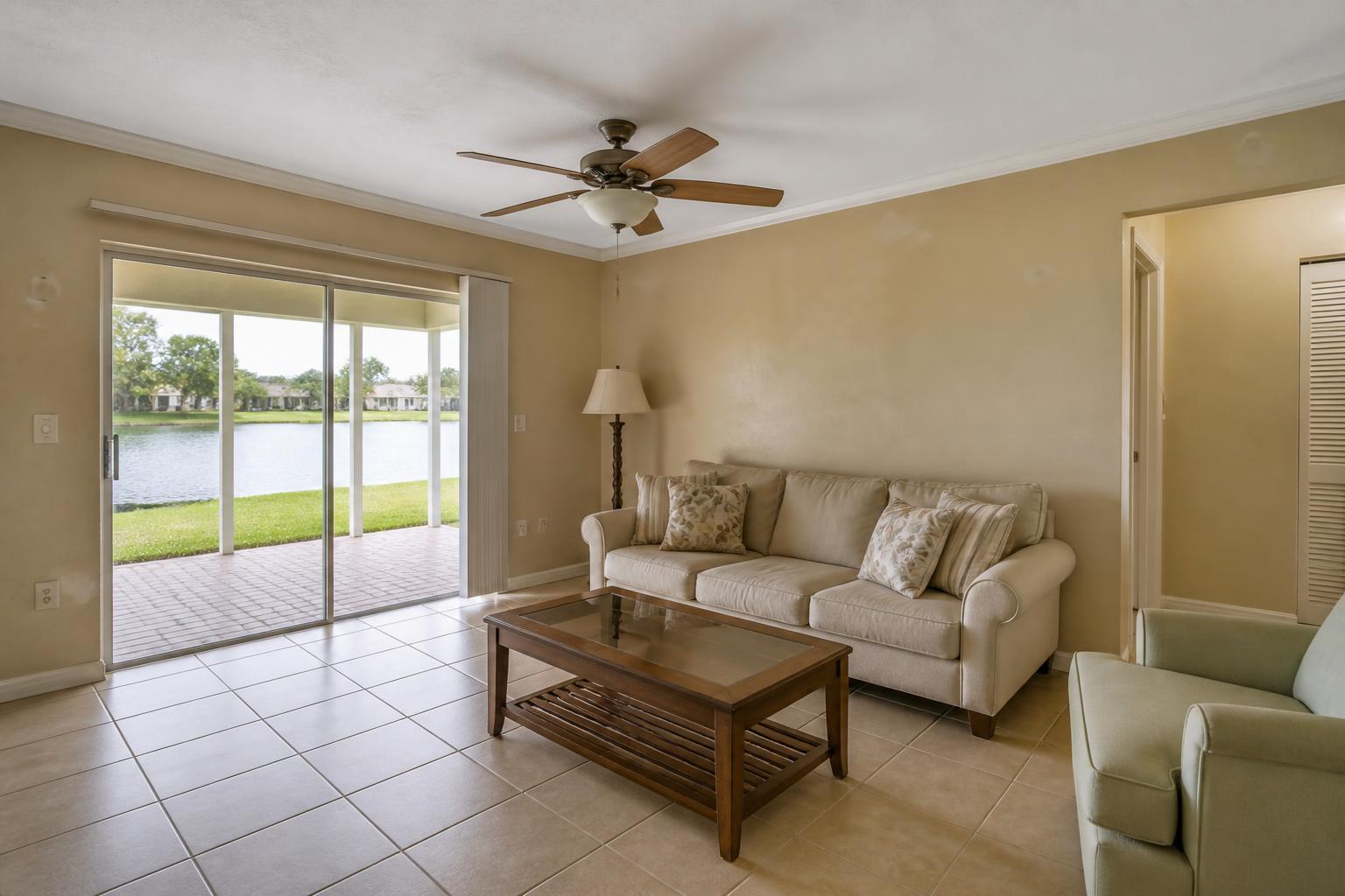 Living room with dated scuffed wall paint before interior painting in Melbourne, FL