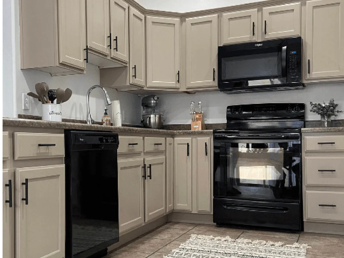 Warm greige refinished kitchen cabinets in Palm Bay, FL