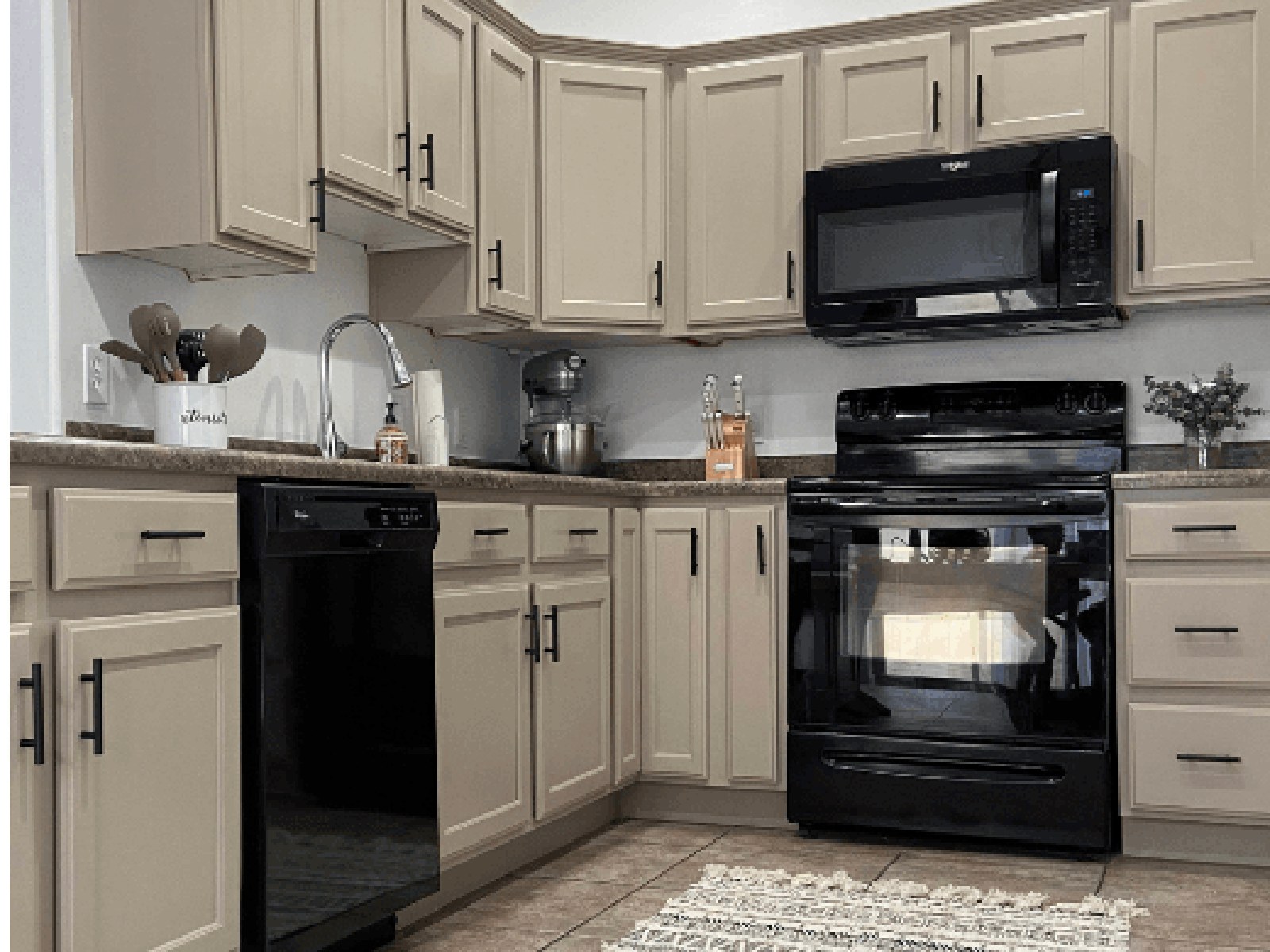Warm greige refinished kitchen cabinets in Palm Bay, FL