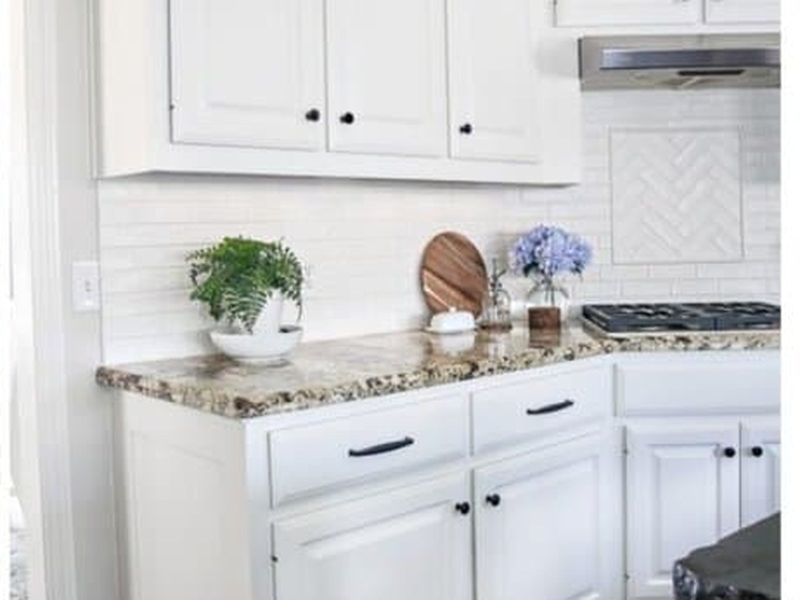 Bright white factory-smooth refinished kitchen cabinets in Viera, FL