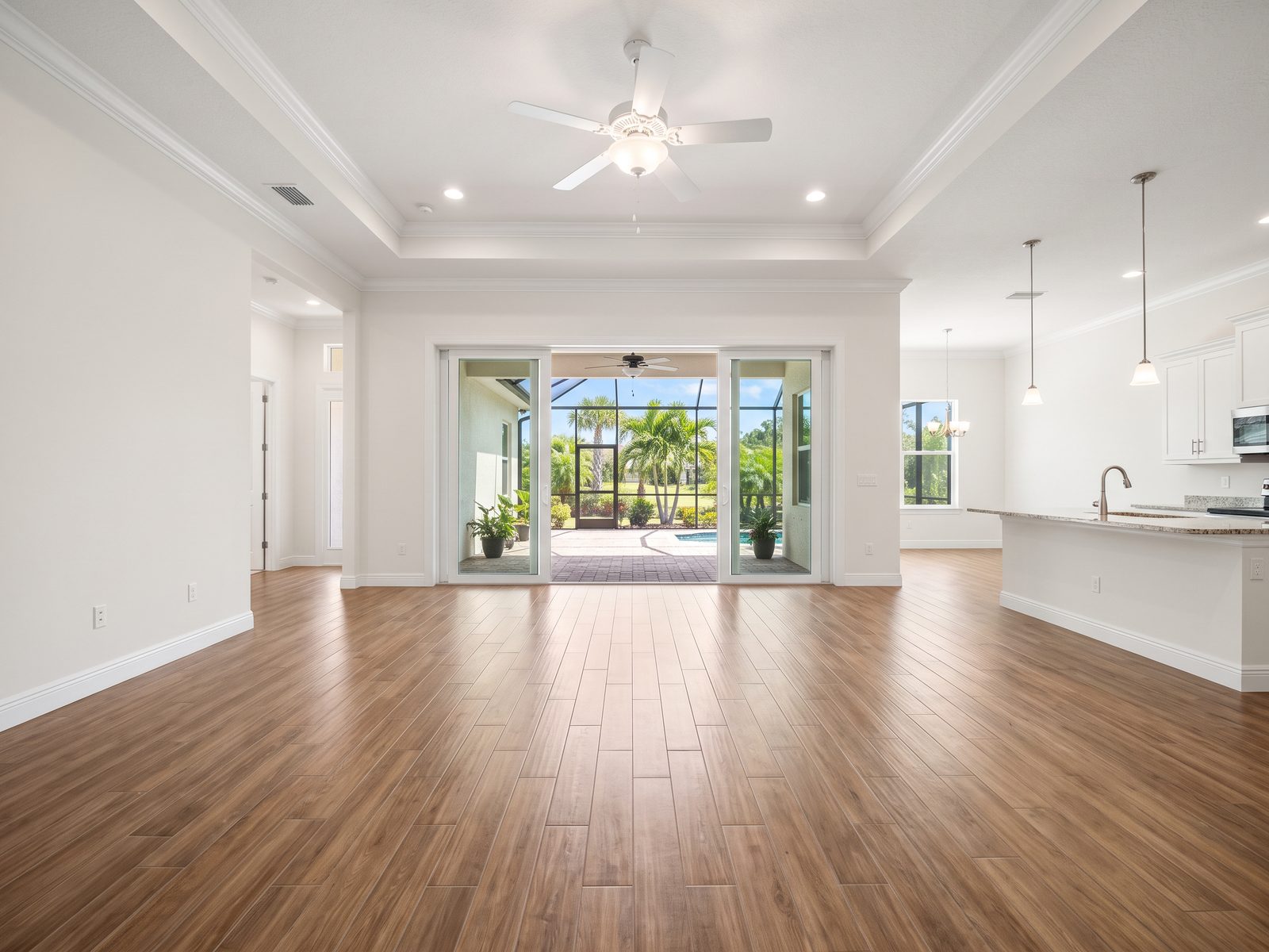 Freshly repainted Melbourne, FL living room with smooth walls and crisp white trim by Pro Touch Painting