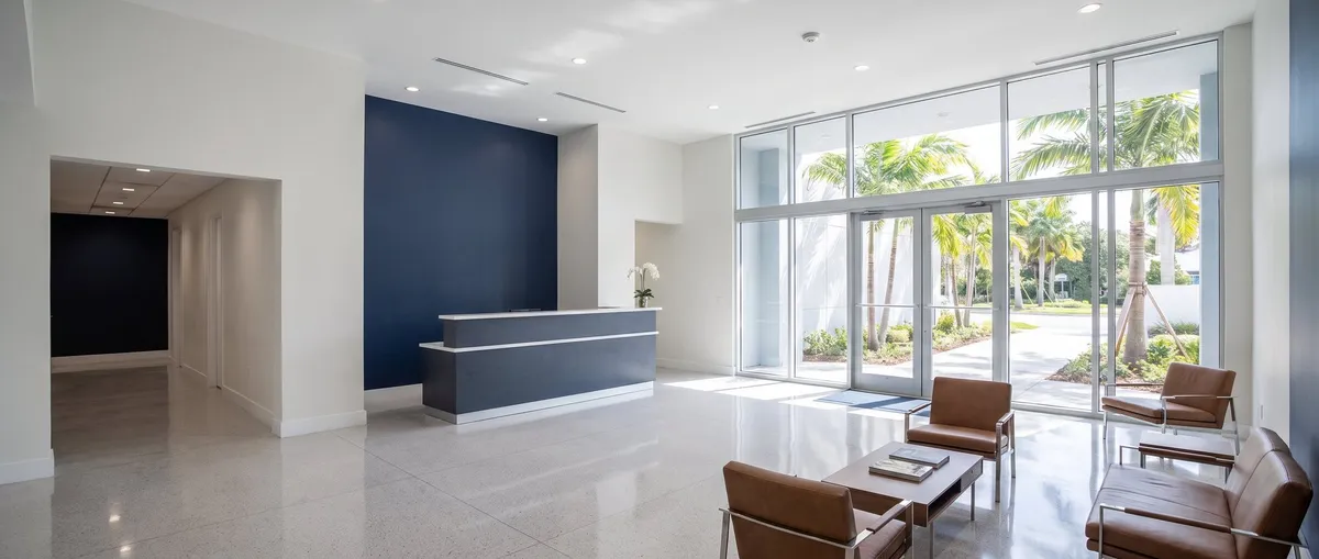 Freshly painted commercial office lobby with light gray walls and white ceiling in Brevard County, FL