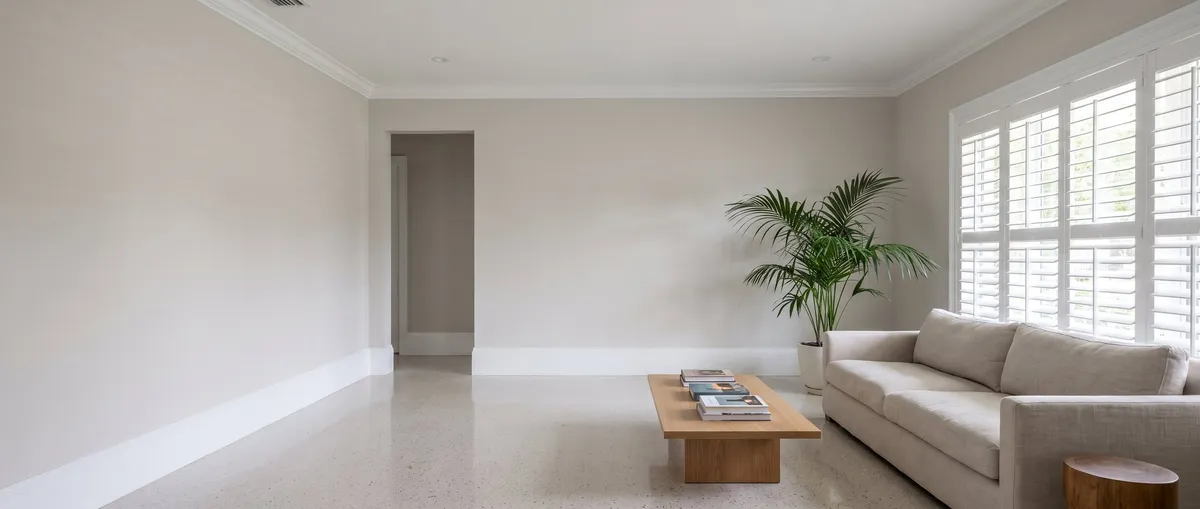 Freshly painted interior hallway and stairwell with warm neutral walls and bright white trim in Brevard County, FL